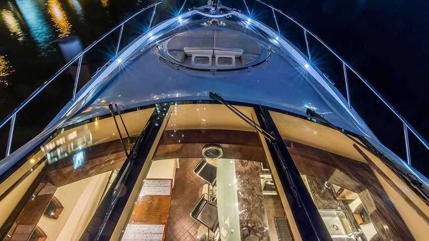 a building with a large glass window aboard LADY H Yacht for Charter