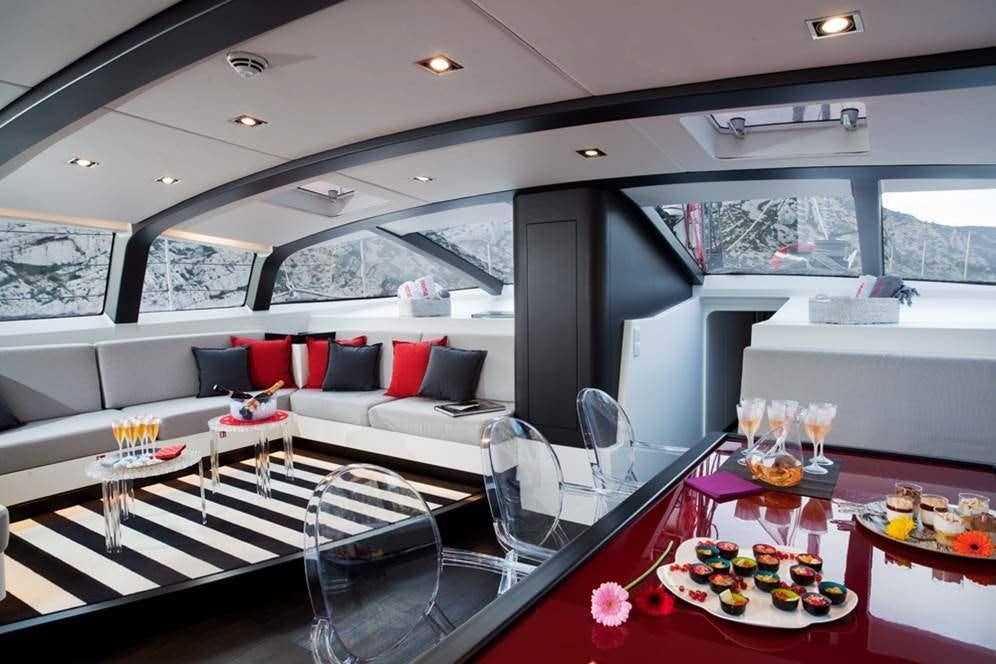 a room with a table and chairs aboard NOMAD IV Yacht for Charter