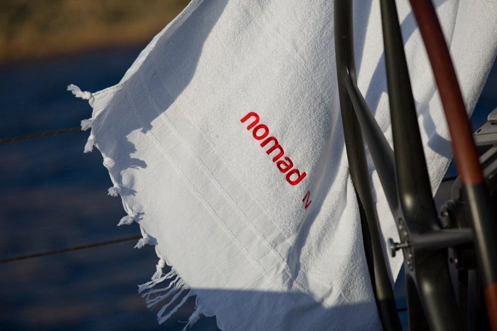 a white flag on a boat aboard NOMAD IV Yacht for Charter