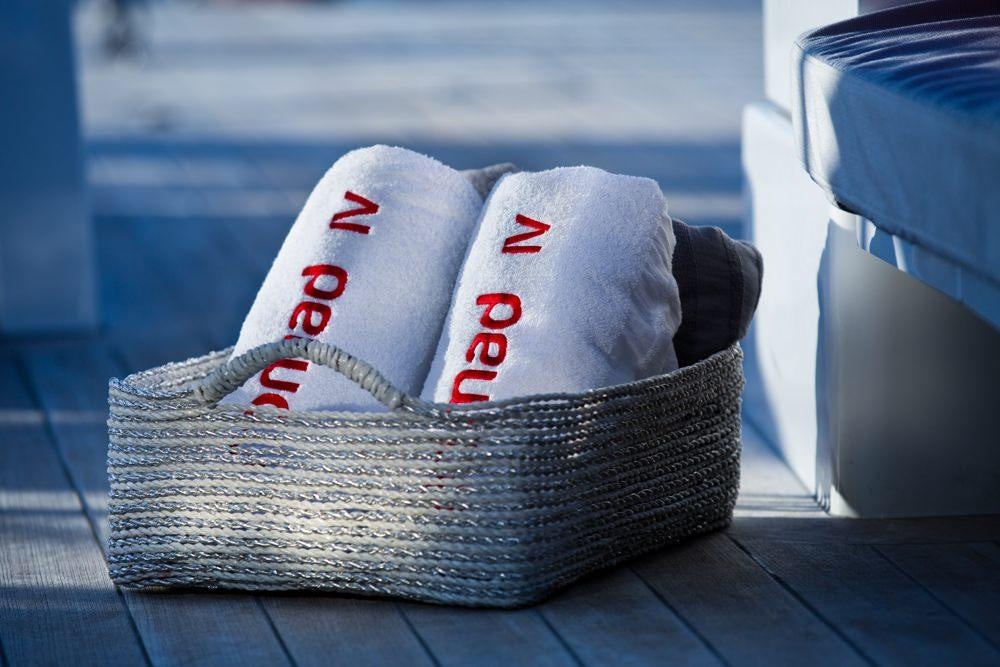 a pair of shoes on a wood surface aboard NOMAD IV Yacht for Charter