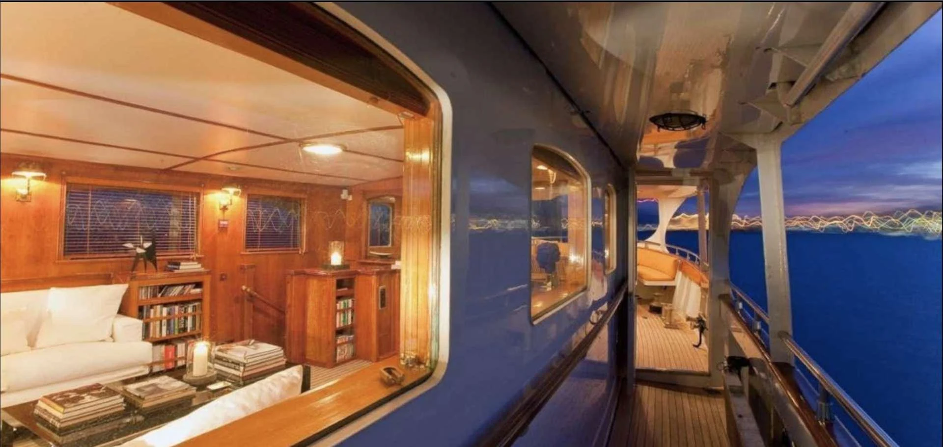 a room with a bed and a blue tent aboard CAMARA C Yacht for Charter