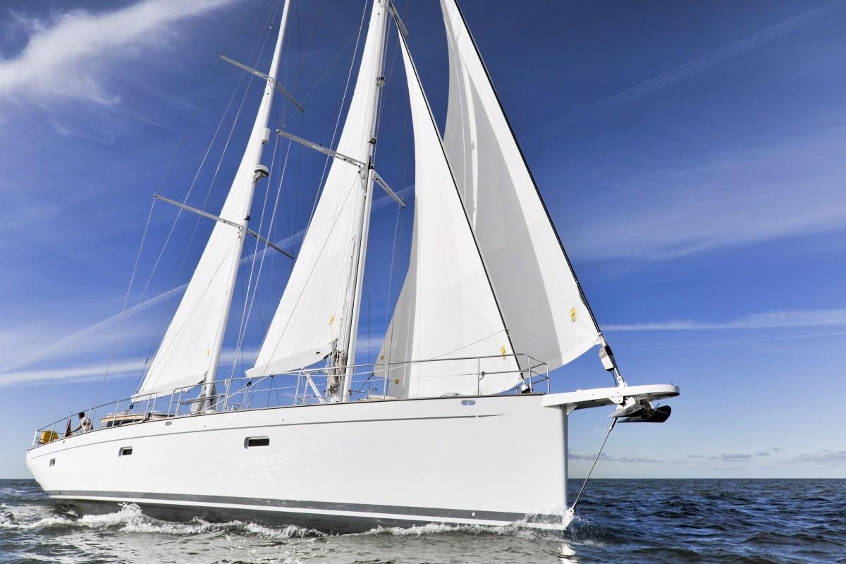 a white sailboat on the water aboard HELENE Yacht for Charter