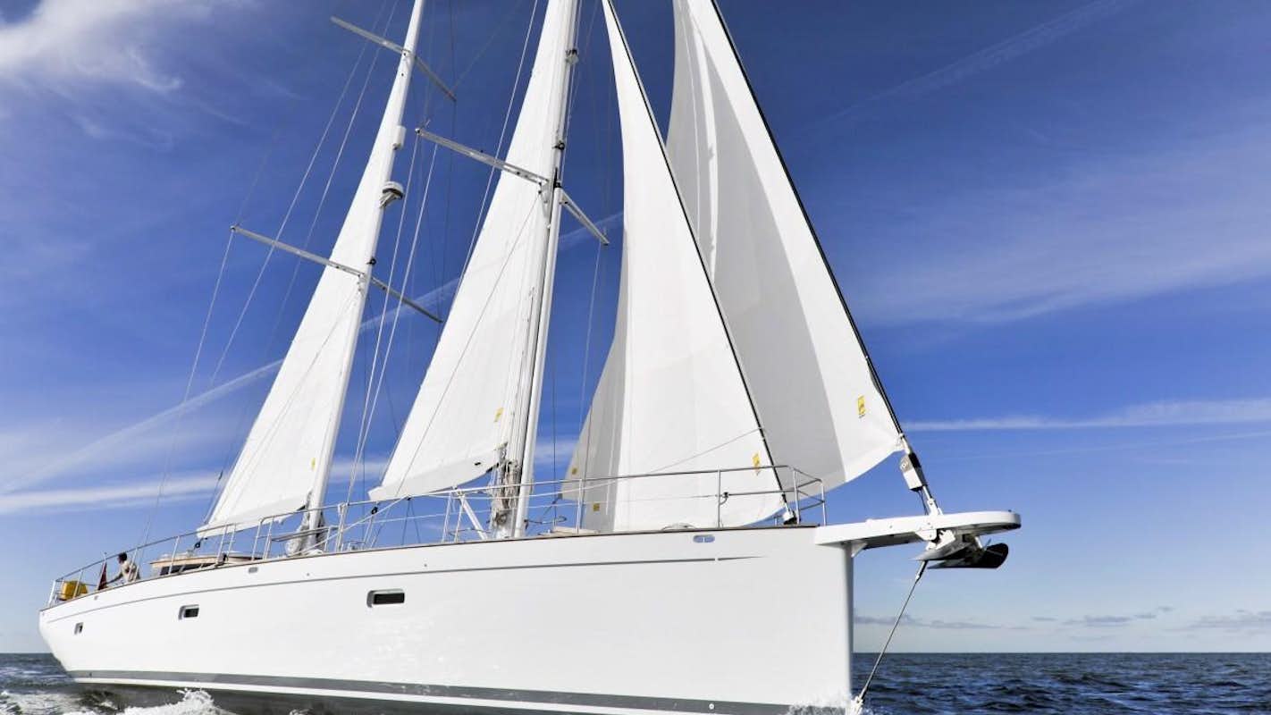 a white sailboat on the water aboard HELENE Yacht for Charter