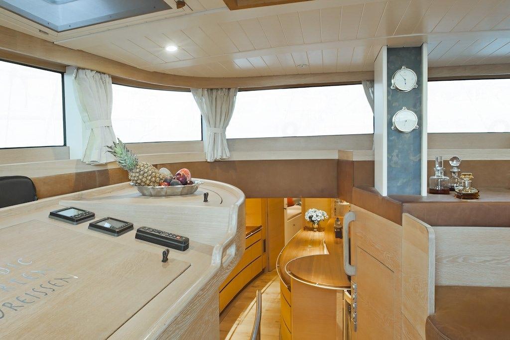 a room with a table and chairs aboard HELENE Yacht for Charter