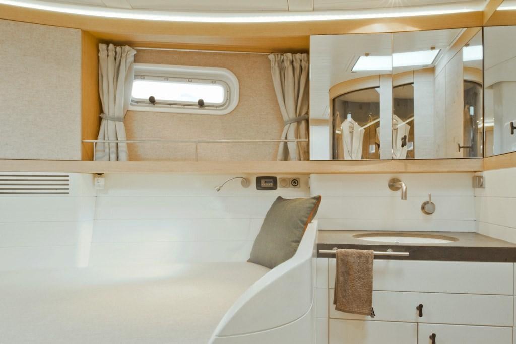 a bathroom with a white couch aboard HELENE Yacht for Charter