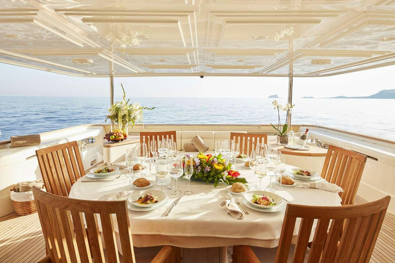 a table set for a meal on a boat aboard BEST OFF Yacht for Charter