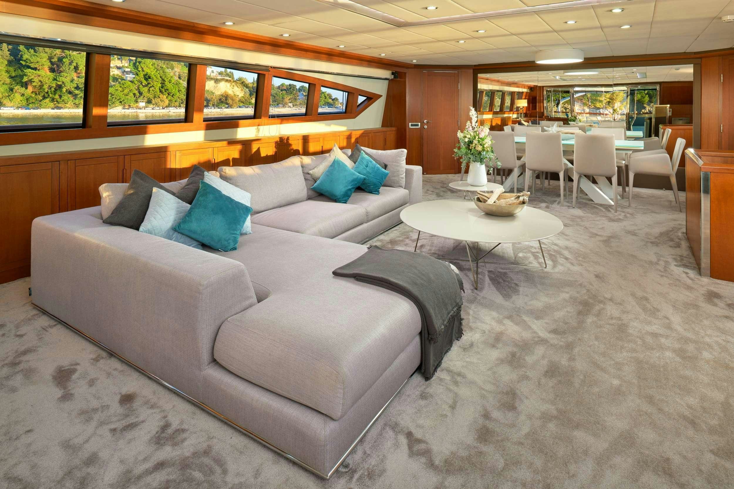 a large living room with a couch aboard SAN LIMI Yacht for Charter