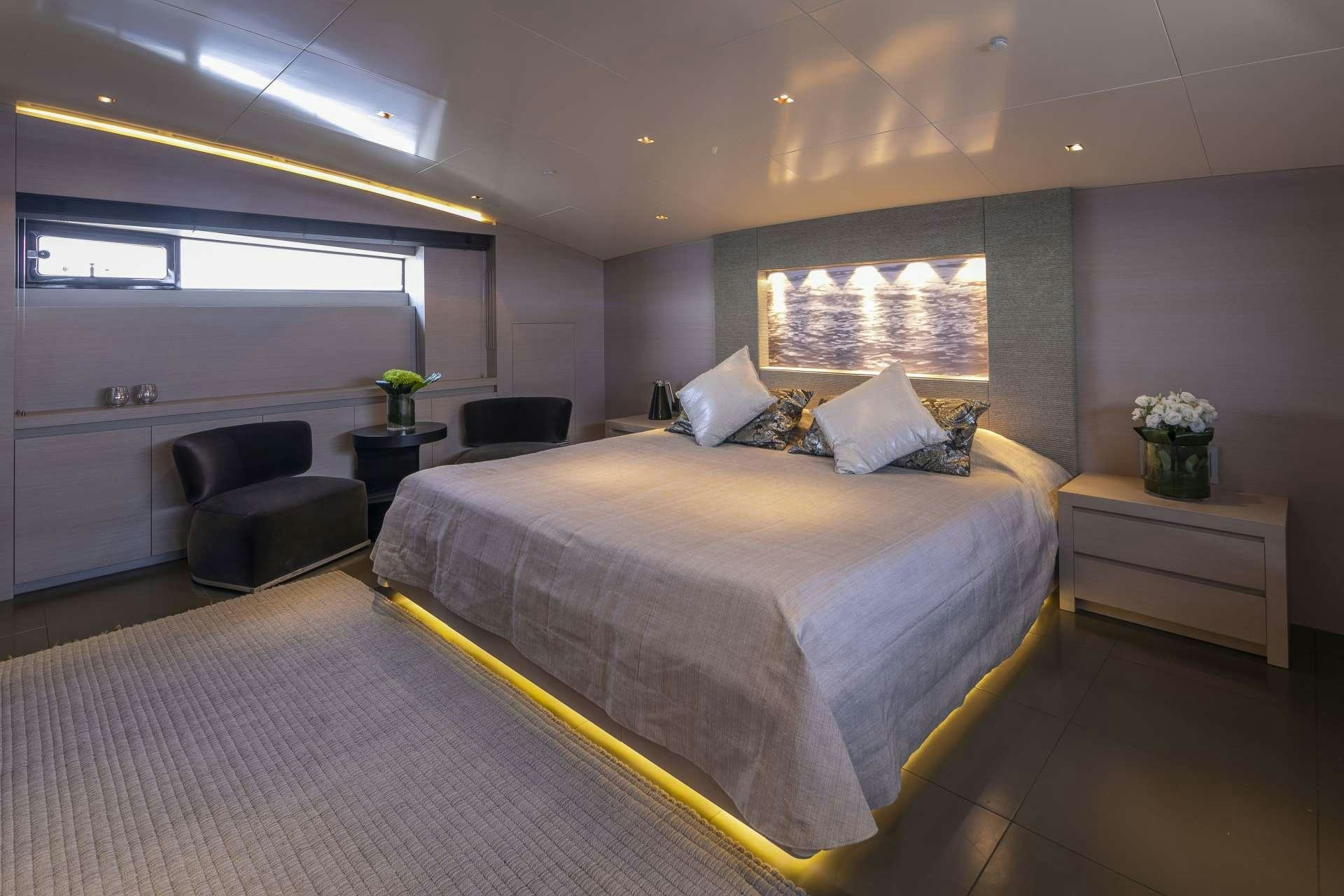 a large bed in a room aboard BILLA Yacht for Charter