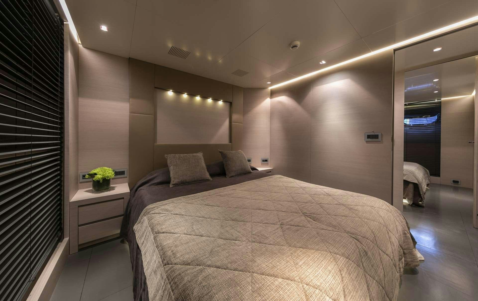 a bed in a room aboard BILLA Yacht for Charter