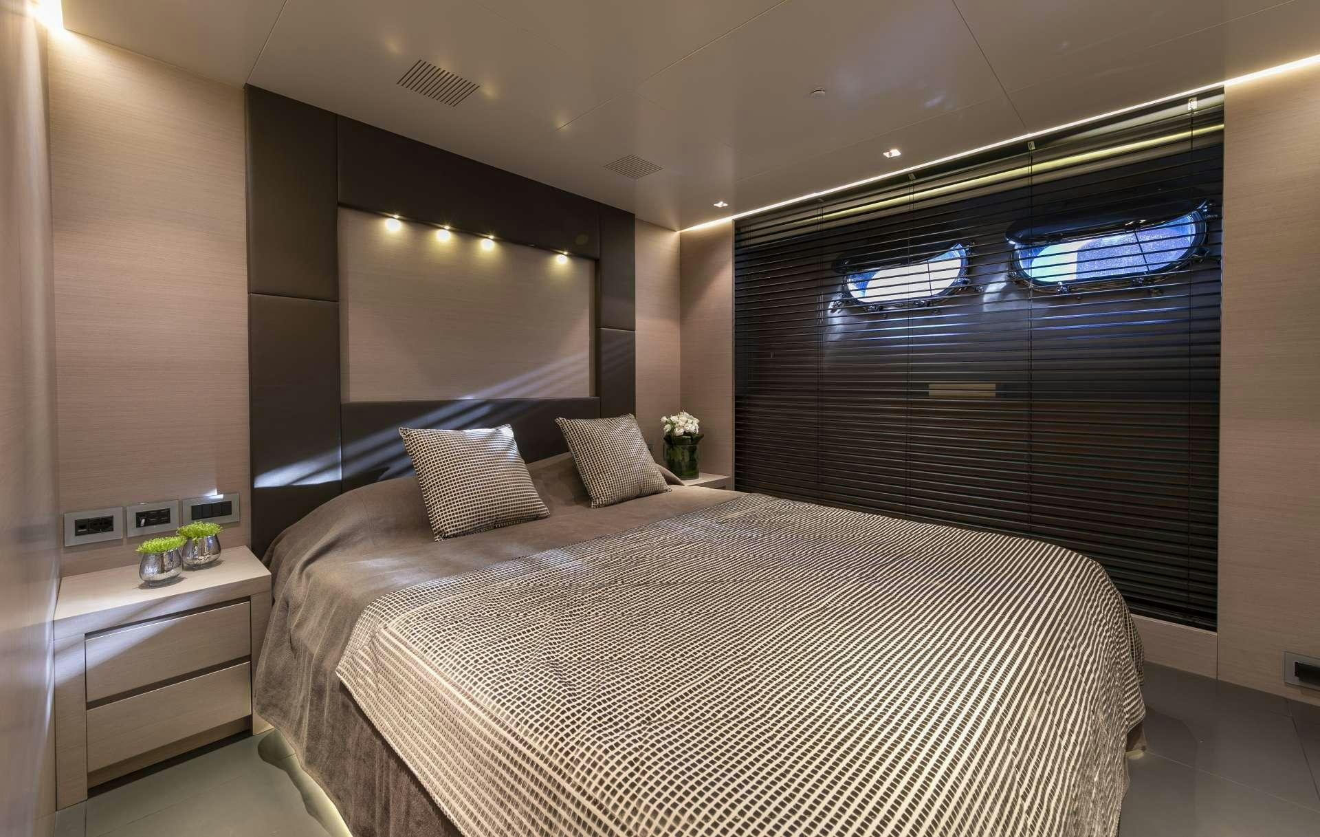 a bed in a room aboard BILLA Yacht for Charter
