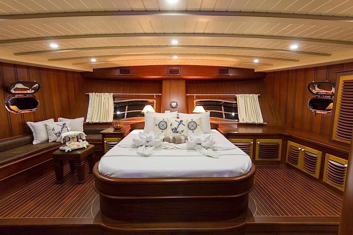 a large bedroom with a large bed aboard PRINCESS KARIA II Yacht for Charter