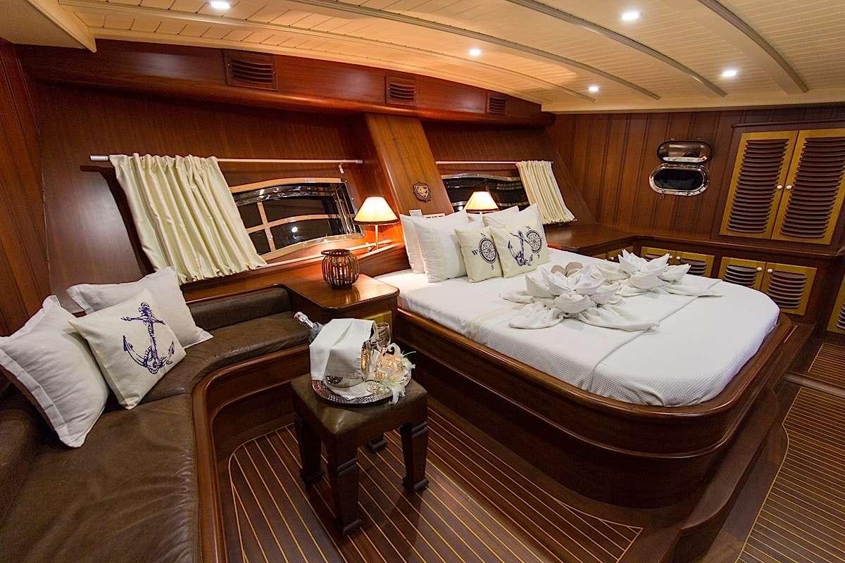 a large bed in a room aboard PRINCESS KARIA II Yacht for Charter