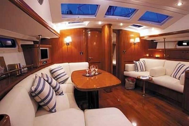 a living room with a couch and a table aboard CAPRICE Yacht for Charter