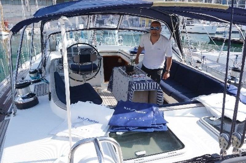 a person standing on a boat aboard CAPRICE Yacht for Charter