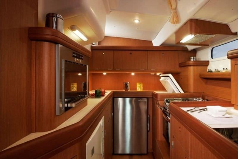 a kitchen with a large refrigerator aboard CAPRICE Yacht for Charter