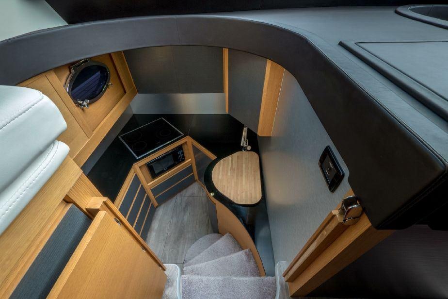 a kitchen with a wood stove aboard TICUN Yacht for Charter