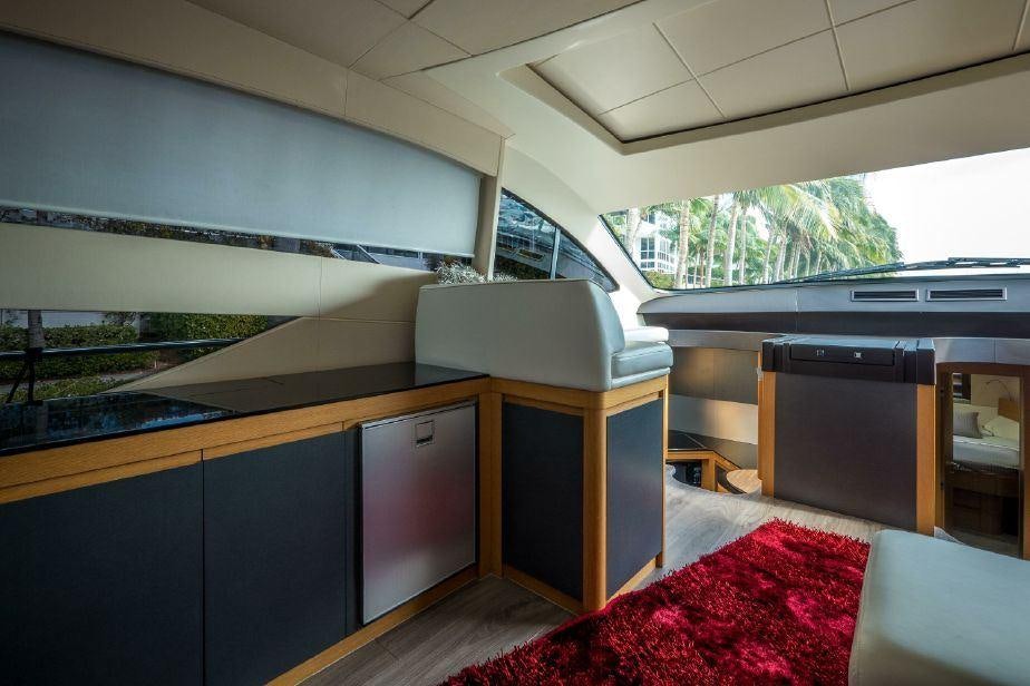 a room with a bed and desk aboard TICUN Yacht for Charter