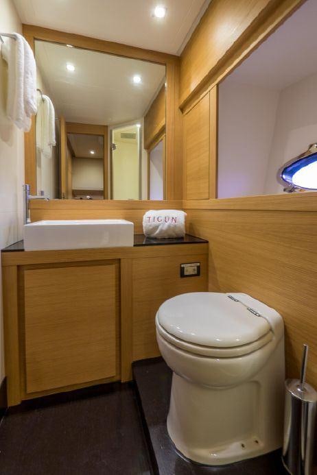 a bathroom with a toilet and a sink aboard TICUN Yacht for Charter