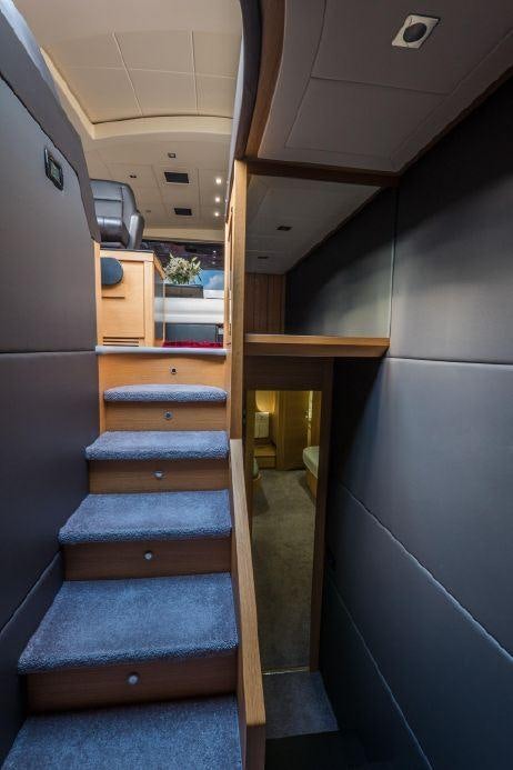 a wooden staircase in a house aboard TICUN Yacht for Charter