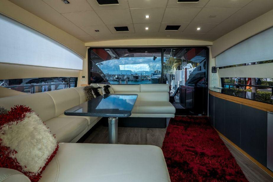 a living room with a large window aboard TICUN Yacht for Charter