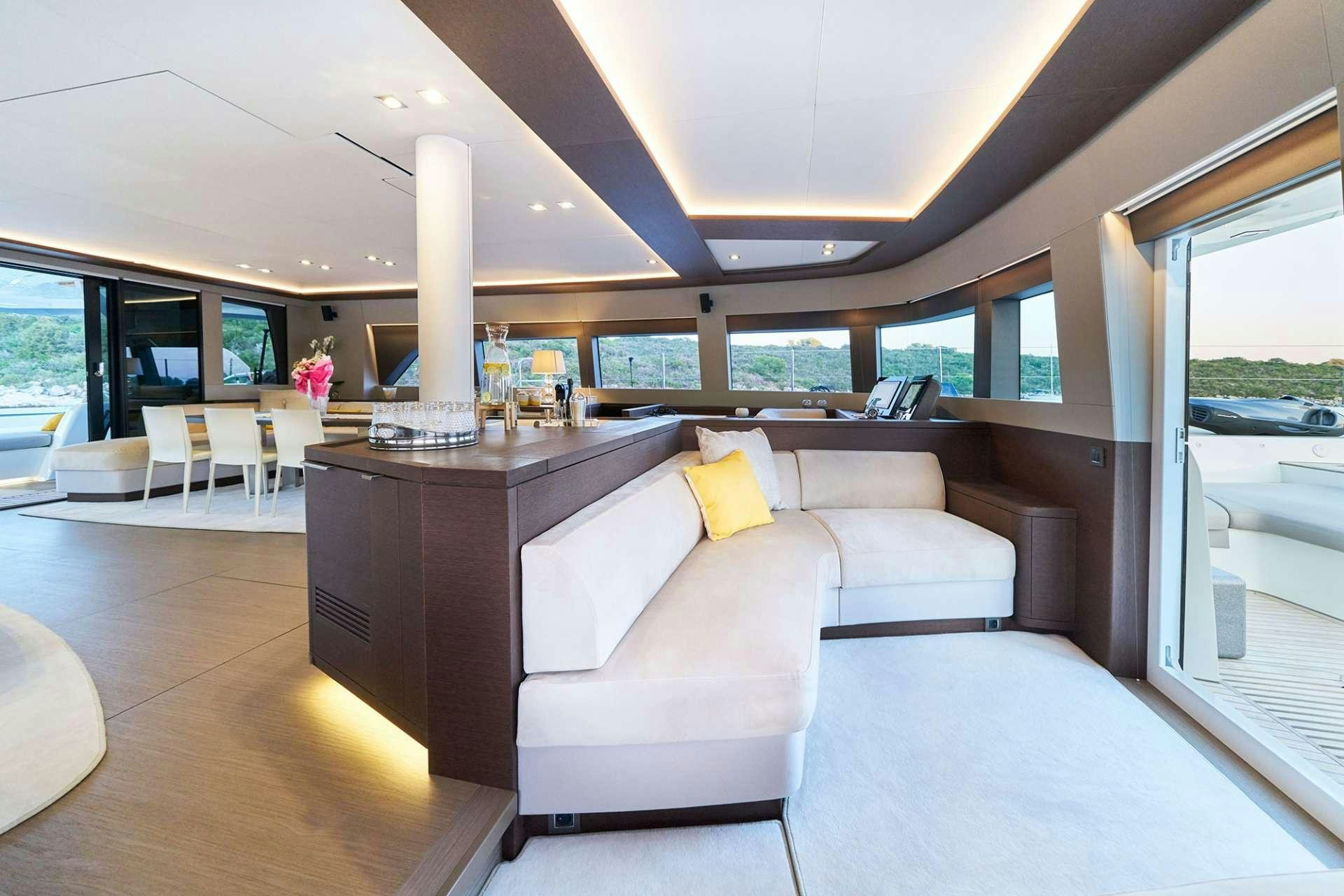 a living room with a large window aboard ADRIATIC DRAGON Yacht for Charter