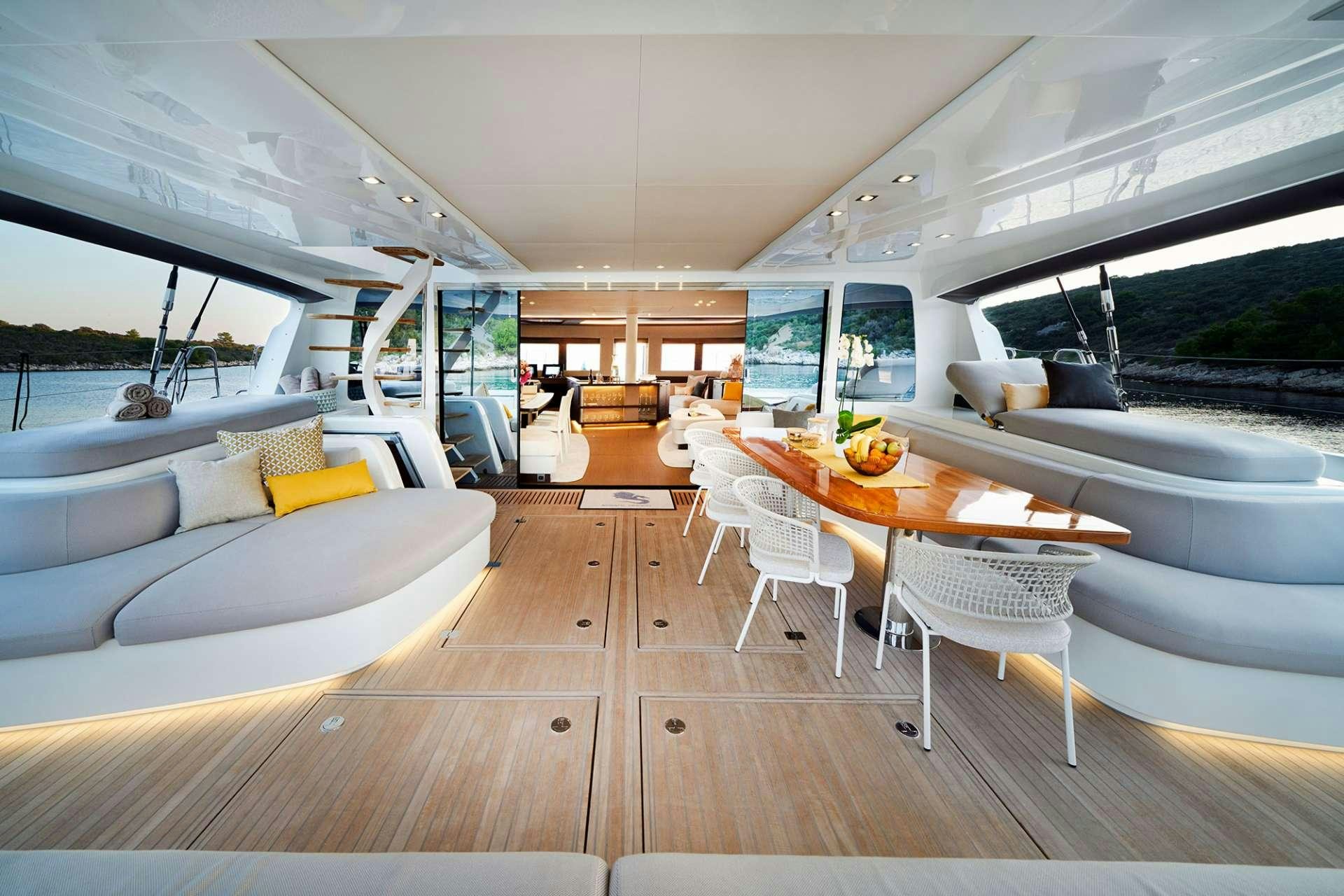 a room with tables and chairs aboard ADRIATIC DRAGON Yacht for Charter