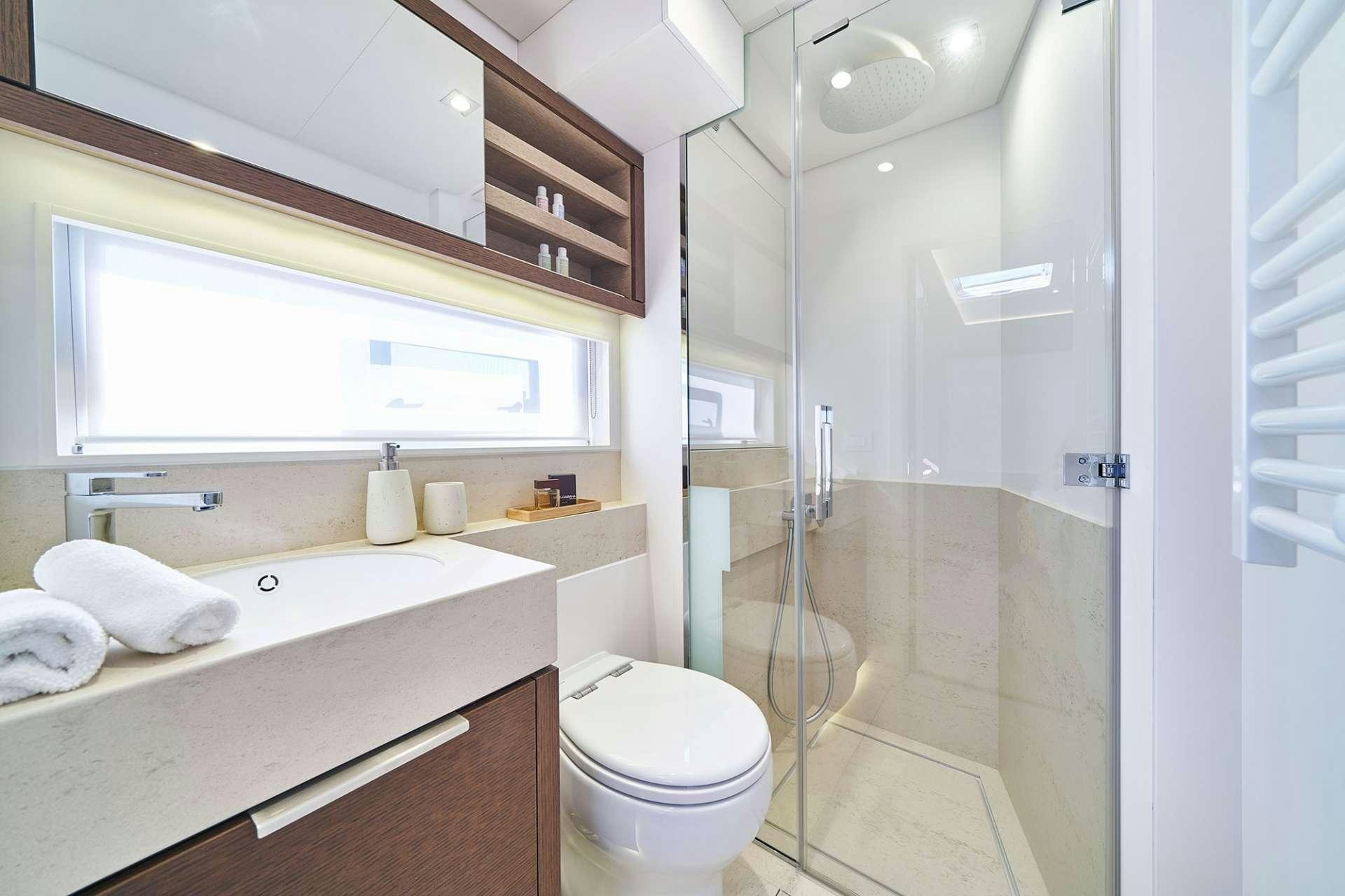 a bathroom with a glass shower aboard ADRIATIC DRAGON Yacht for Charter