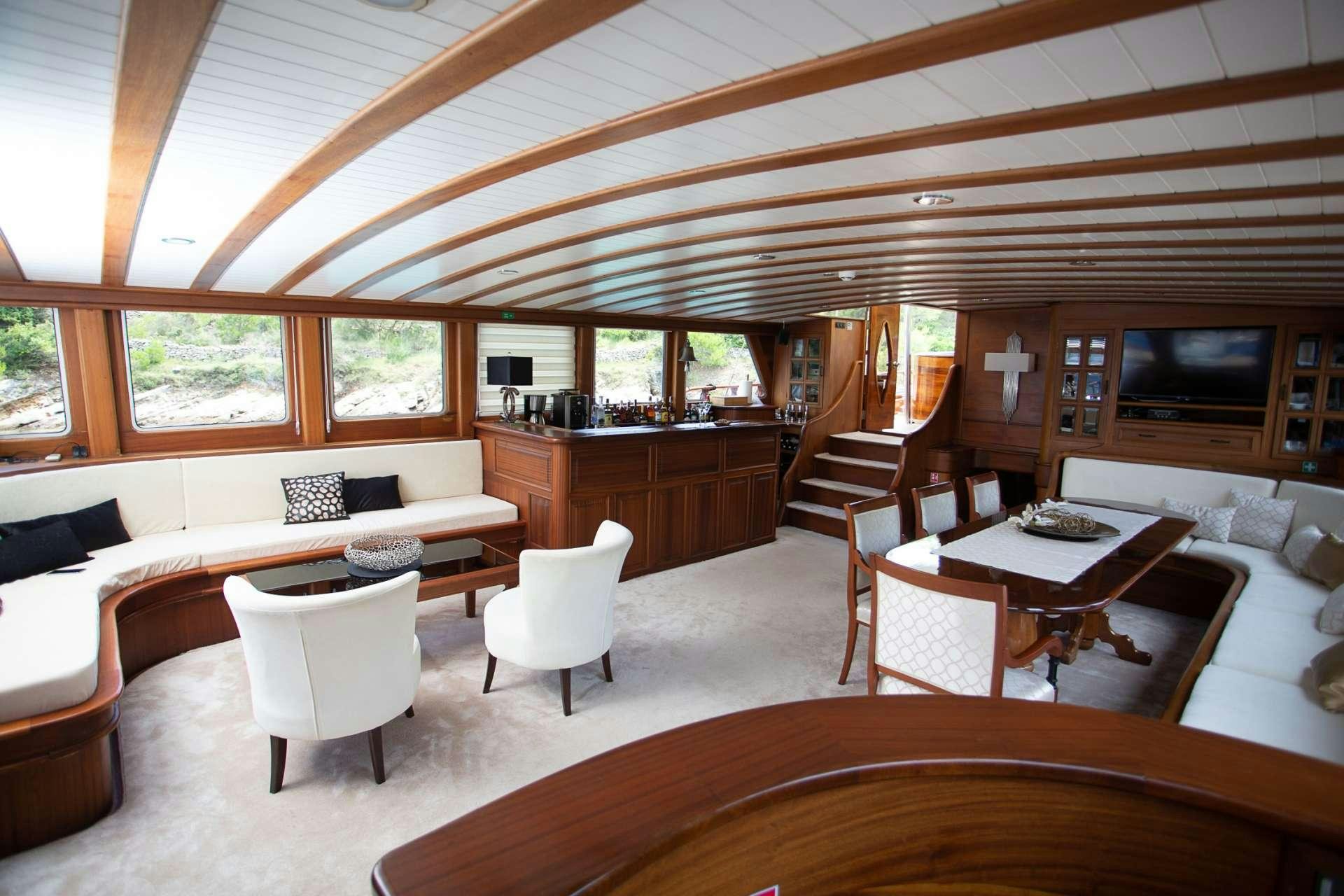 a living room with a wood ceiling aboard DOLCE VITA Yacht for Charter