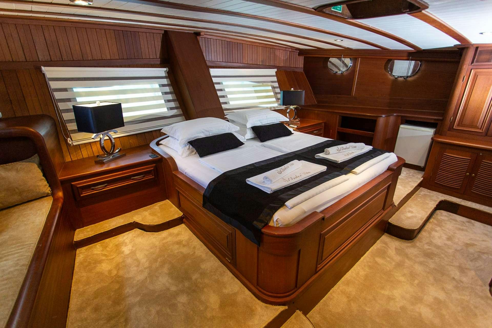 a bed in a cabin aboard DOLCE VITA Yacht for Charter