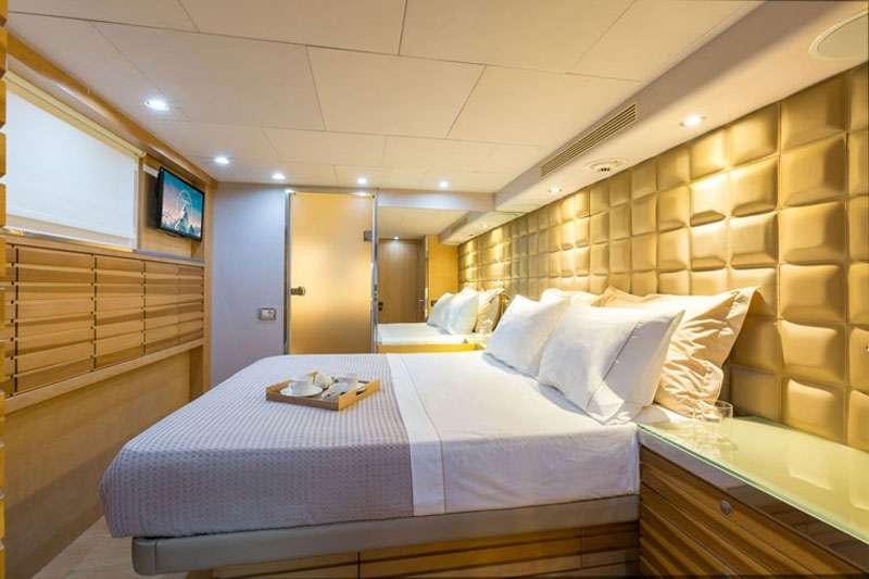 a bed in a room aboard HEESEN Yacht for Charter