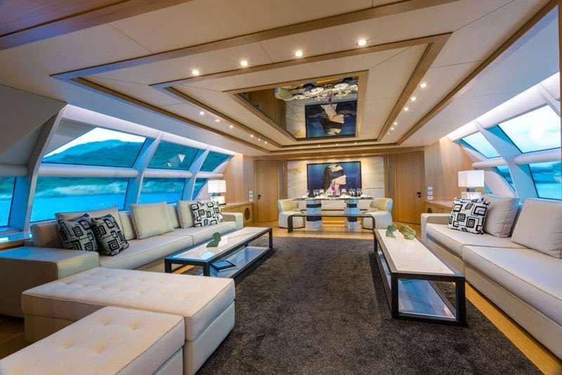 a living room with a large window aboard HEESEN Yacht for Charter