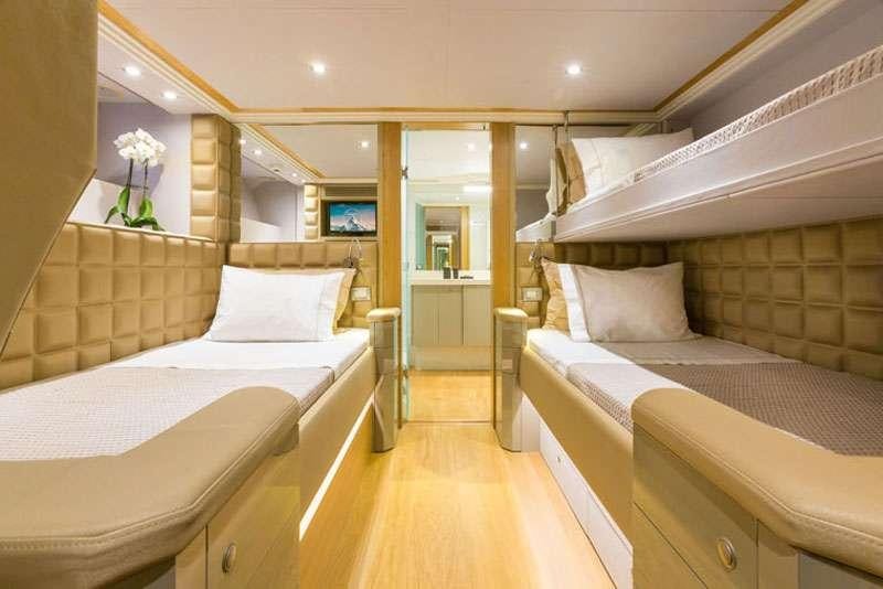 a room with two beds aboard HEESEN Yacht for Charter