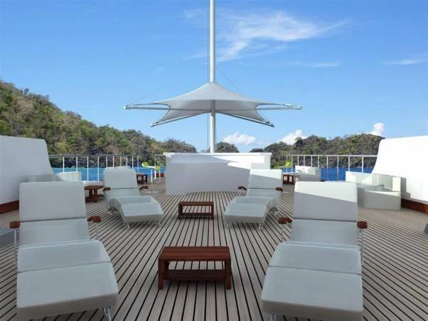 a deck with a large fan aboard ELARA 1 Yacht for Charter