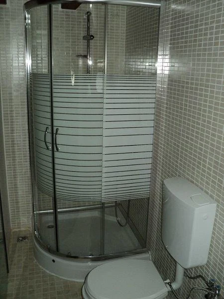 a bathroom with a glass shower aboard ELARA 1 Yacht for Charter