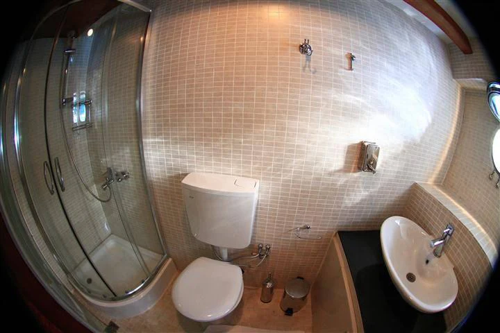 a bathroom with a glass shower aboard ELARA 1 Yacht for Charter