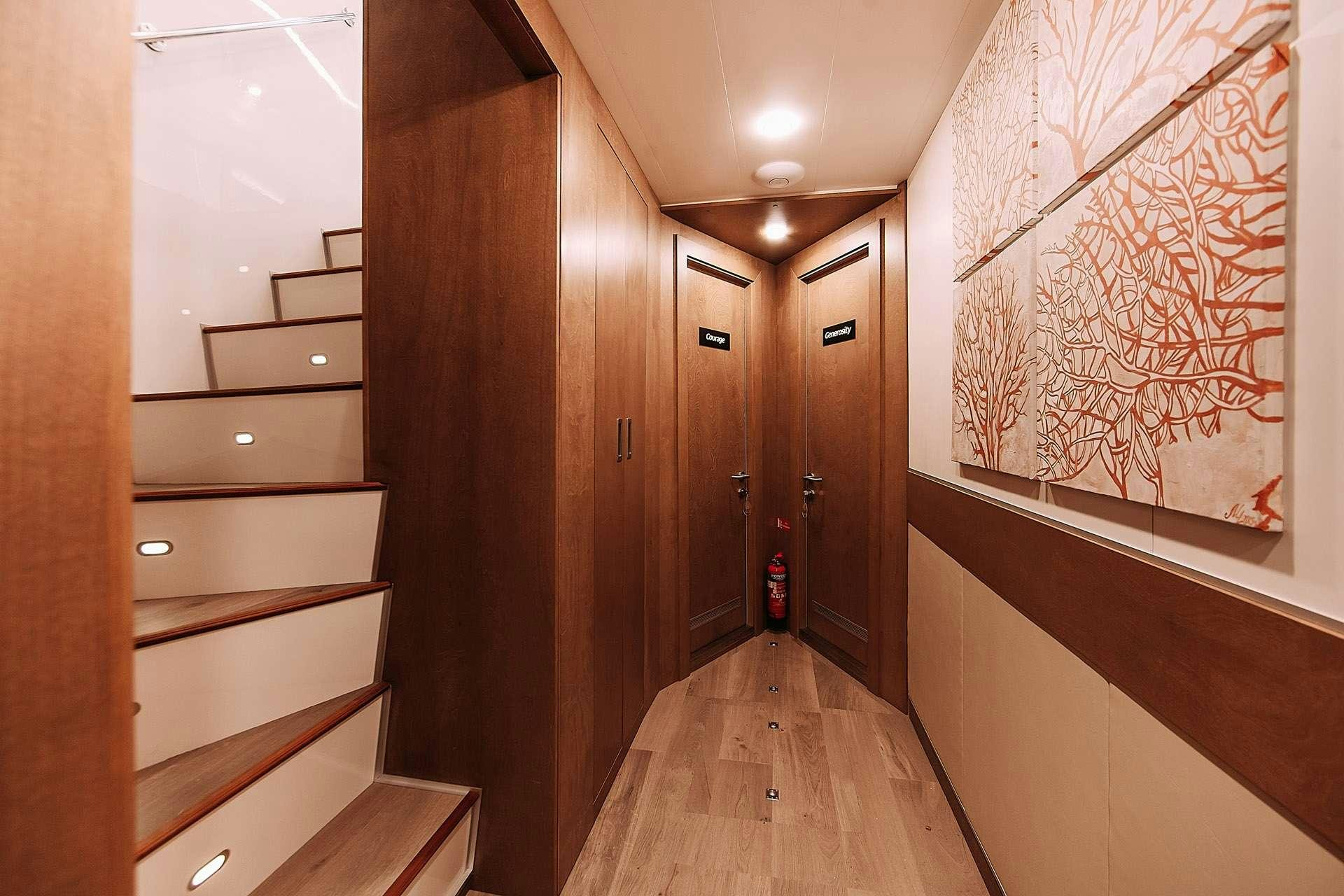 a hallway with wooden cabinets aboard ALICE Yacht for Charter