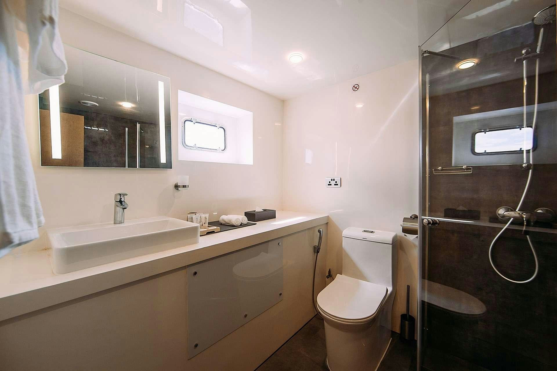 a bathroom with a sink and a toilet aboard ALICE Yacht for Charter
