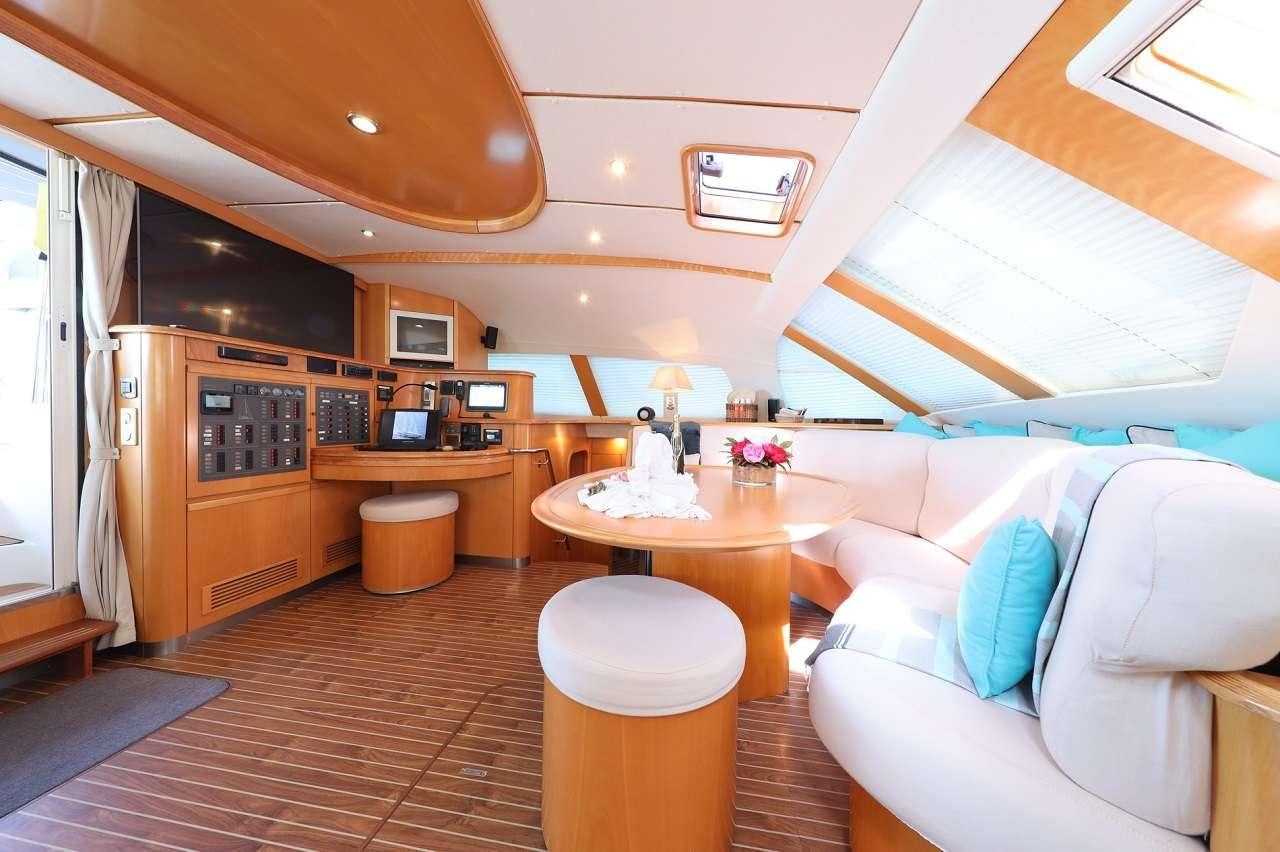 a room with a couch and a table aboard OCEAN MED Yacht for Charter