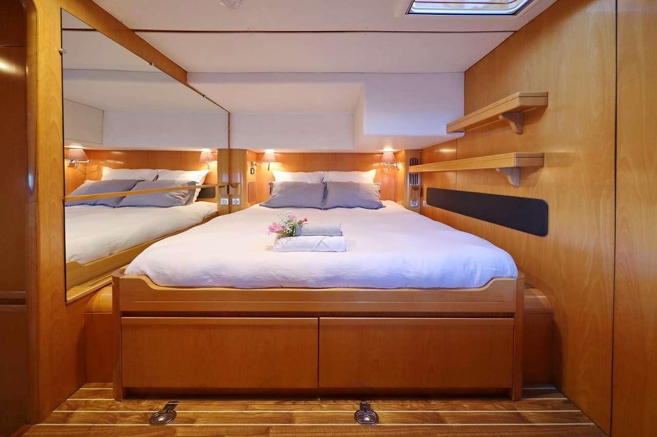 a room with two beds aboard OCEAN MED Yacht for Charter