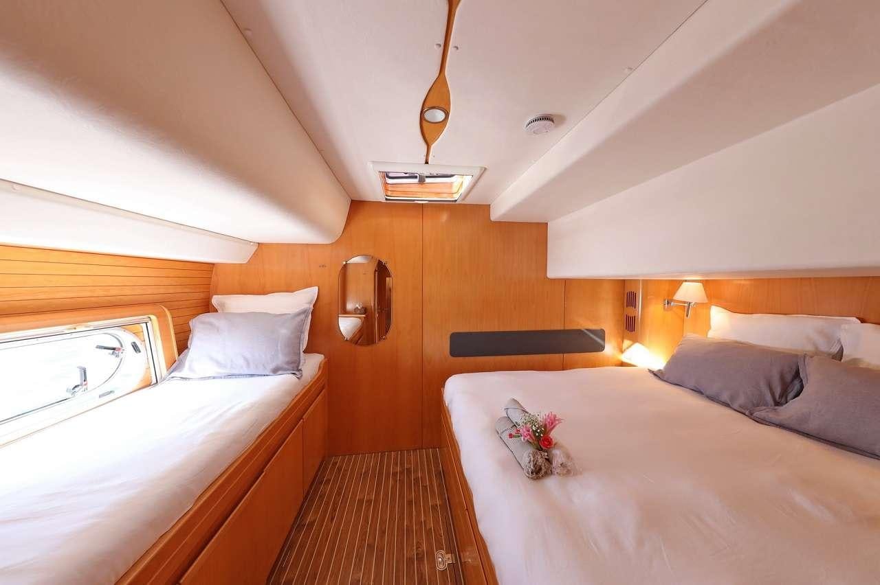 a room with two beds aboard OCEAN MED Yacht for Charter