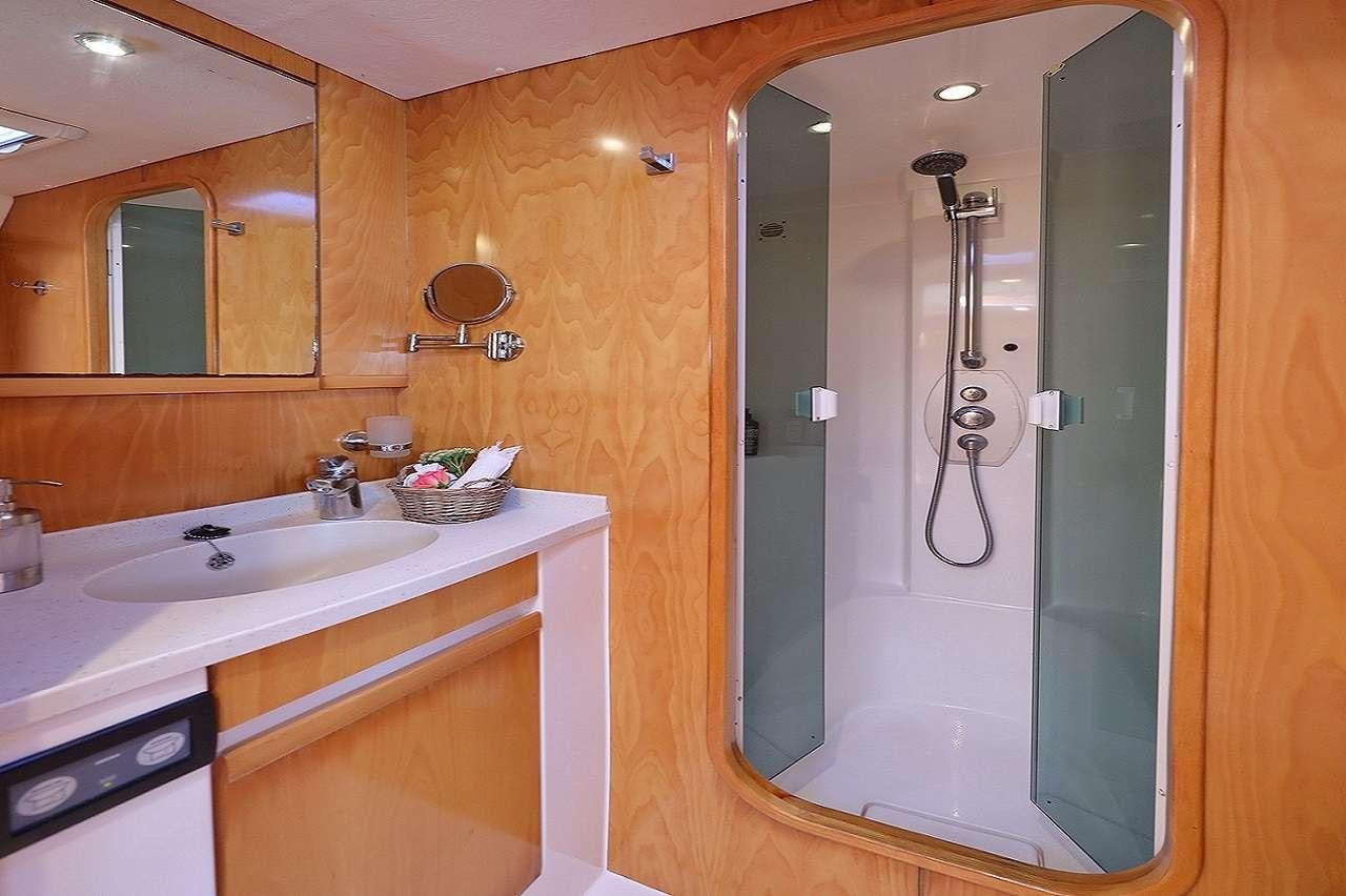 a bathroom with a large shower unit aboard OCEAN MED Yacht for Charter