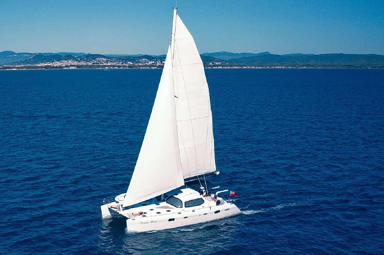 a white boat on the water aboard OCEAN MED Yacht for Charter
