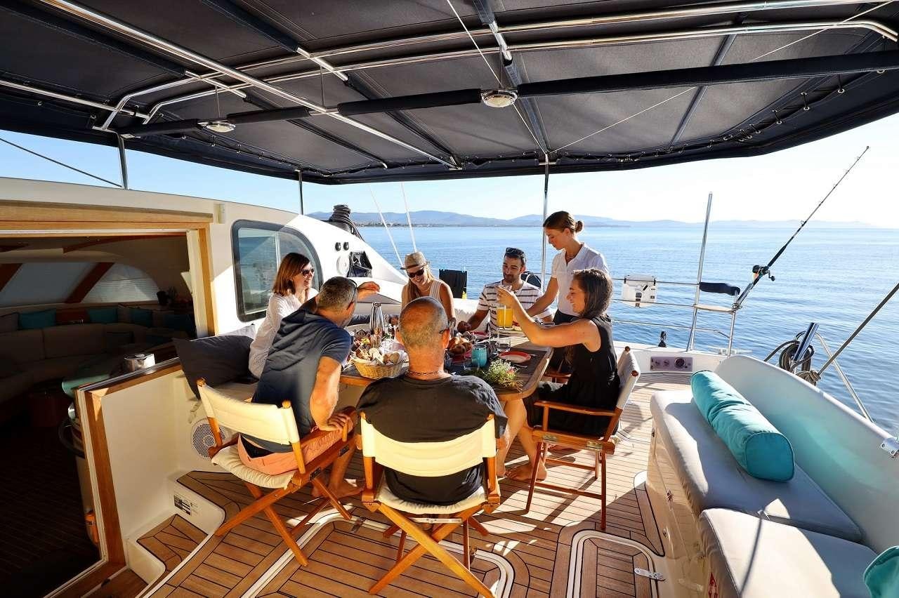 a group of people on a boat aboard OCEAN MED Yacht for Charter