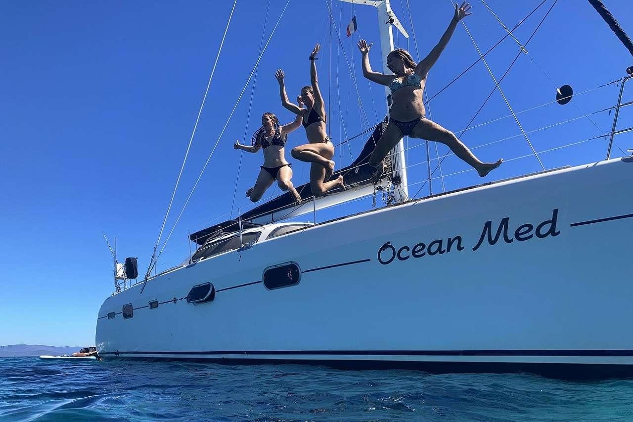 a group of people on a boat aboard OCEAN MED Yacht for Charter