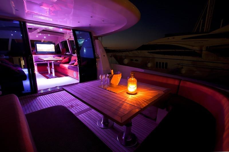 a table with a couple of candles on it aboard SAURON Yacht for Charter