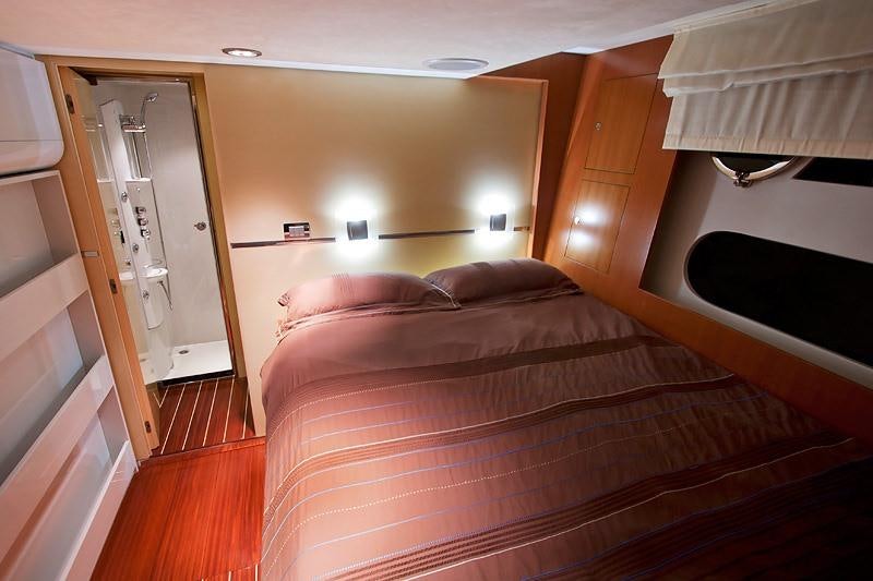 a bed in a room aboard SAURON Yacht for Charter