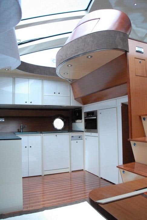 a kitchen with a large ceiling fan aboard SAURON Yacht for Charter