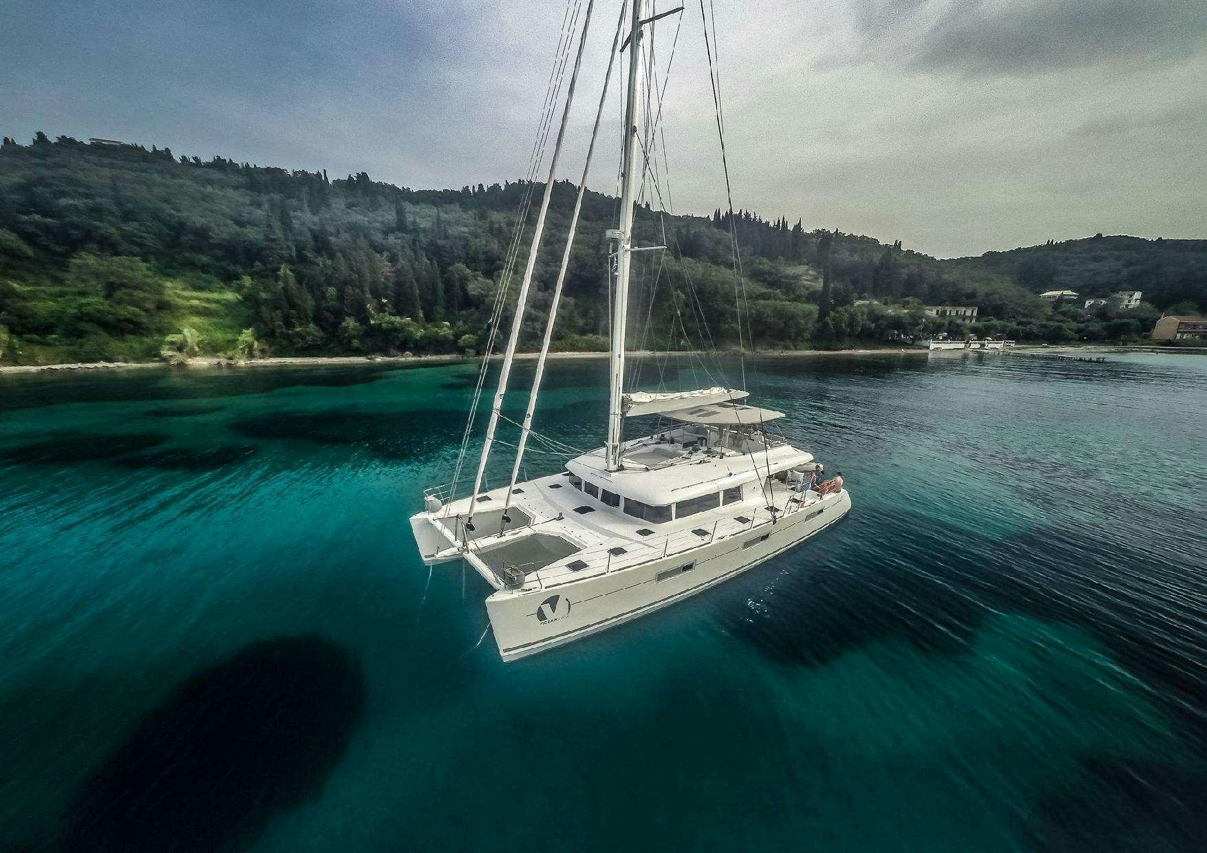 a white boat in the water aboard OCEAN VIEW Yacht for Charter