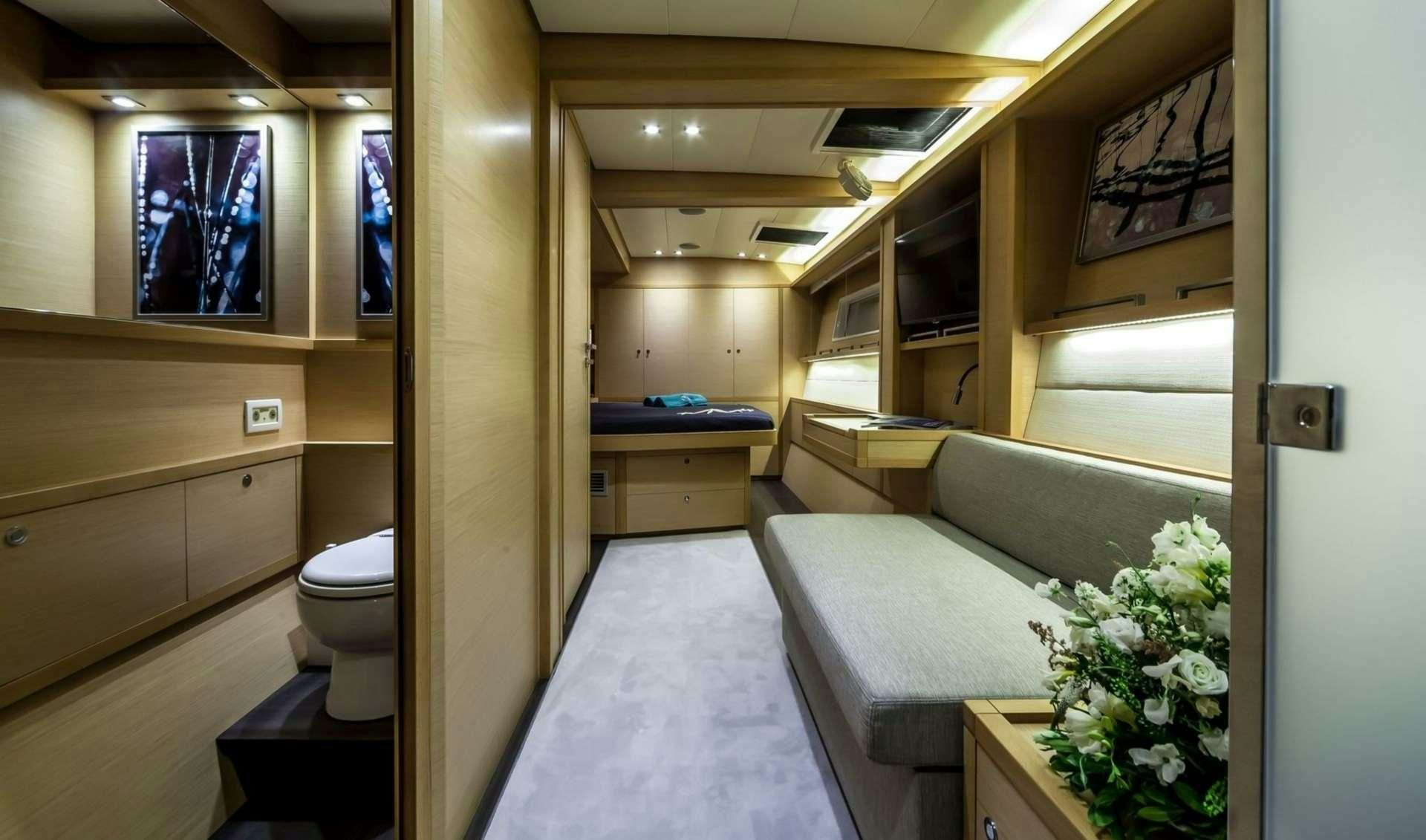 a bathroom with a tub and a bed aboard OCEAN VIEW Yacht for Charter