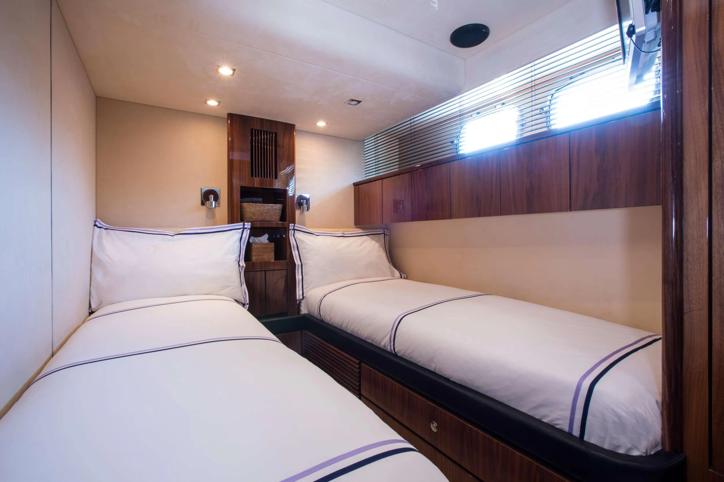 a room with two beds aboard D5 Yacht for Charter